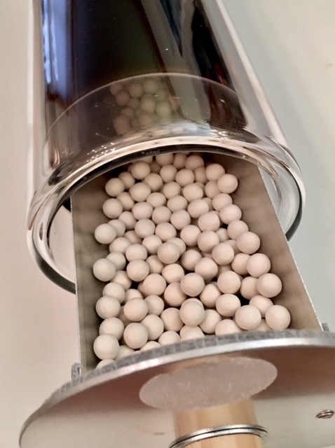 The solar thermal vacuum tube can efficiently heat to recharge Zeolite pellets. Without a reflector it can heat up to 212 F or 100 C. With reflectors up to 400 F or 204 C.